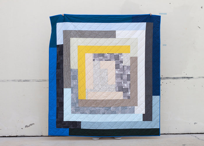 Ray quilt in blues, blacks and yellow fabrics
