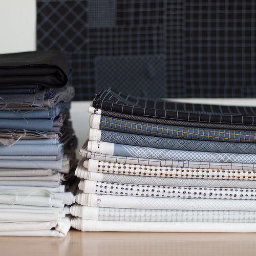 CF grid group fabrics stacked up next to Kona Cotton solids