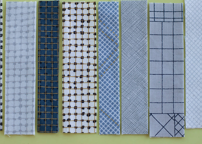 fabric swatches in grey and white fabrics