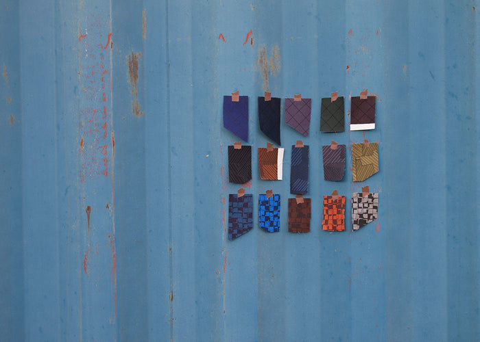 swatches of fabric mounted on a blue background