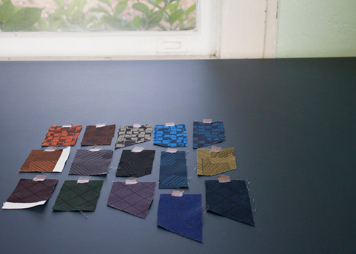 Instead fabric swatches on a table by the window