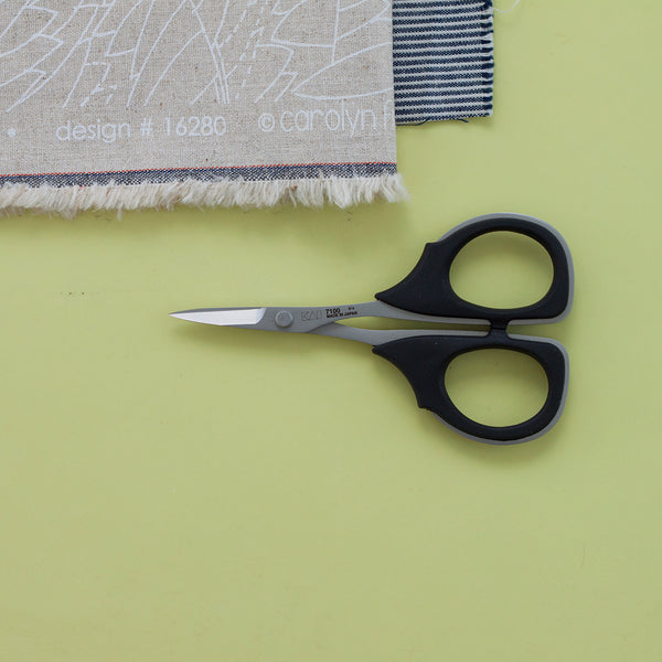 small Kai scissors on a yellow background