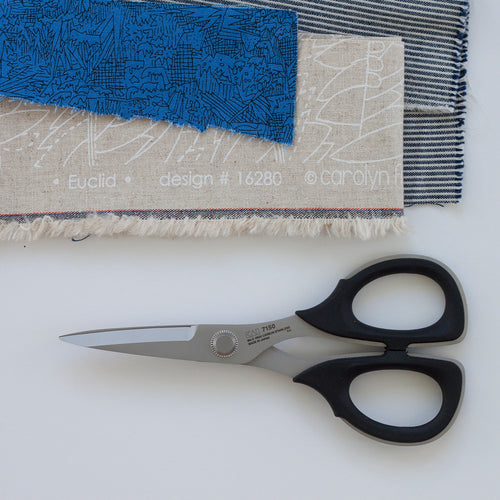 Kai 7150 Scissor on a white background with fabric