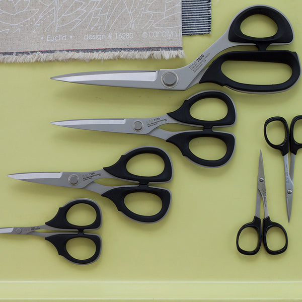 Kai Scissors in a variety of sizes on a yellow background